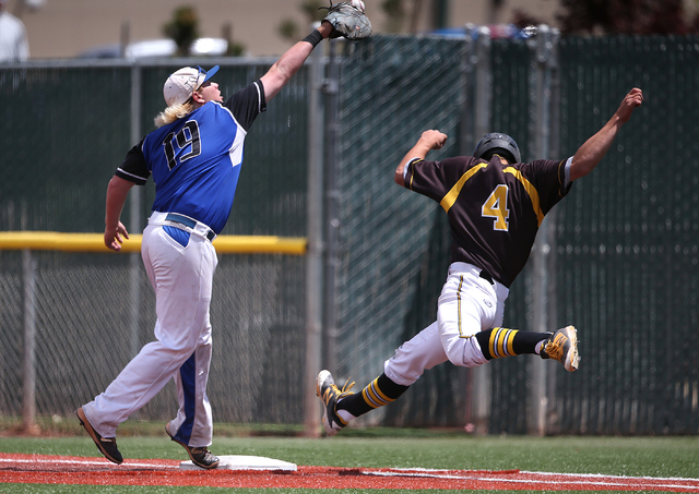 Galena’s Charles Douglas makes it safely to first as Basic’s Jack Wold reaches f ...