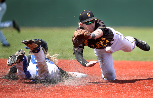 Galena’s Andrew West dives for a throw as Basic’s David Hudleson reaches second ...