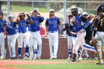 Basic teammates celebrate after J.J. Smith’s home run against Galena during NIAA DI ba ...