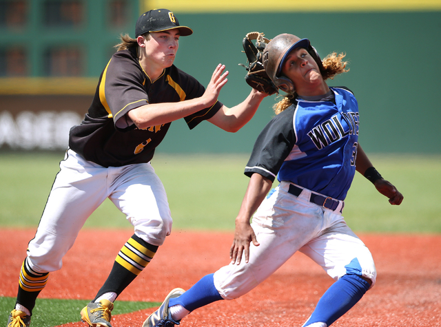 Galena’s Tom Lichty tags Basic’s Christian Rivero during NIAA DI baseball action ...