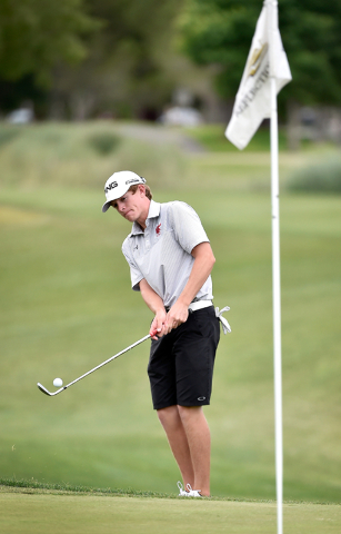 Arbor View’s Sam Dickey chips the ball to the green during the first round of Division ...