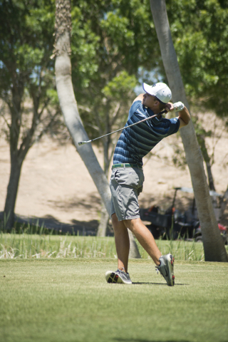 Shadow Ridge’s Tanner Johnson tees off during the Division I state boys golf tournamen ...
