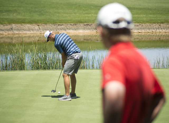 Shadow Ridge’s Tanner Johnson putts during the Division I state boys golf tournament a ...