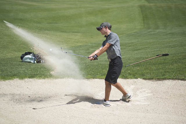 Palo Verde’s Joe Ender hits his ball out of a bunker during the Division I state boys ...