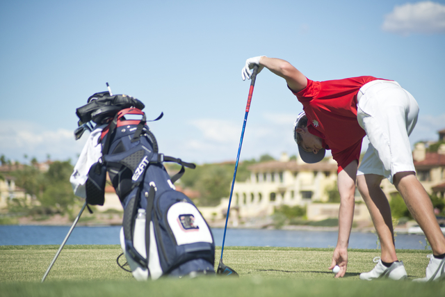 Arbor View’s Sam Dickey places his ball during the Division I state boys golf tourname ...