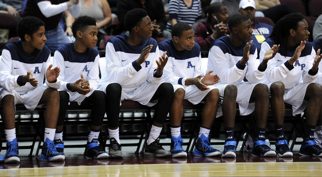 The Agassi Prep bench claps after a foul is called against The Meadows School in the first q ...