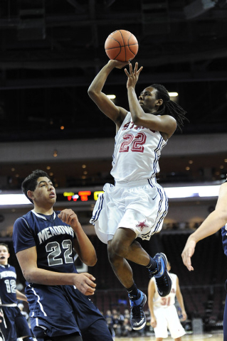 Agassi Prep forward Jordan Smith (22) is fouled by The Meadows School center Max Hisatake in ...