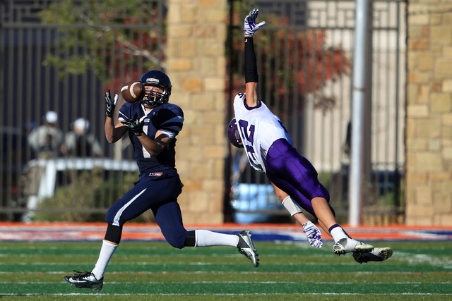 The Meadows’ wide receiver Ethan Fridman pulls in a pass under coverage by Yerington l ...