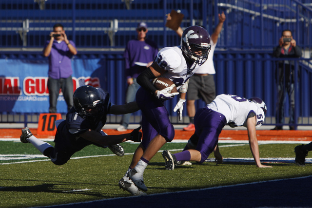 Yerington wide receiver Reese Neville gets past The Meadows defensive back Ethan Fridman and ...