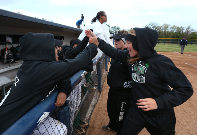 Rancho coaches fire up their team between innings of an NIAA DI softball game against Reed a ...