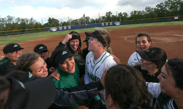 The Rancho Rams celebrate a 12-0 win in five innings over Reed to advance to the championshi ...