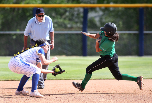 Rancho’s Lili Gutierrez gets tagged out by Reed’s Kenzi Goins during NIAA DI sof ...