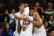 Bishop Gorman’s Stephen Zimmerman, Nick Blair and Chase Jeter embrace in the closing m ...