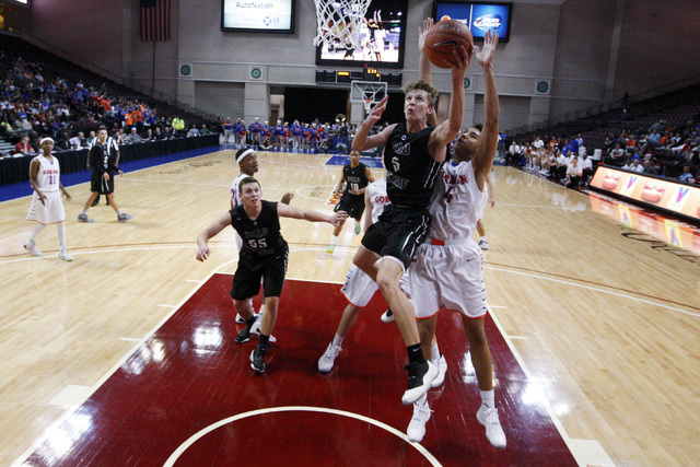 Palo Verde forward Grant Dressler is defended by Bishop Gorman center Chase Jeter during the ...