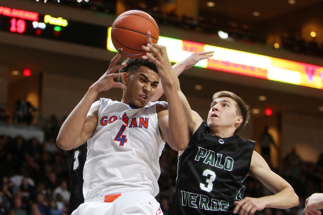 Bishop Gorman center Chase Jeter and Palo Verde forward Furious Fernandes fight for a reboun ...