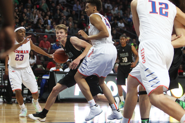 Palo Verde forward Grant Dressler tries to find a way around Bishop Gorman center Chase Jete ...