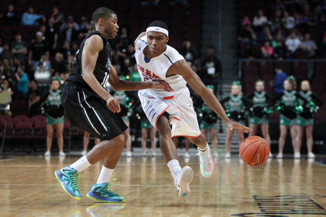 Bishop Gorman guard Nick Blair is covered by Palo Verde guard Ja Morgan during their Divisio ...