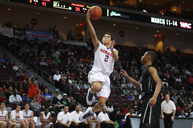Bishop Gorman guard Richie Thornton finds an easy path to the basket past Palo Verde guard J ...