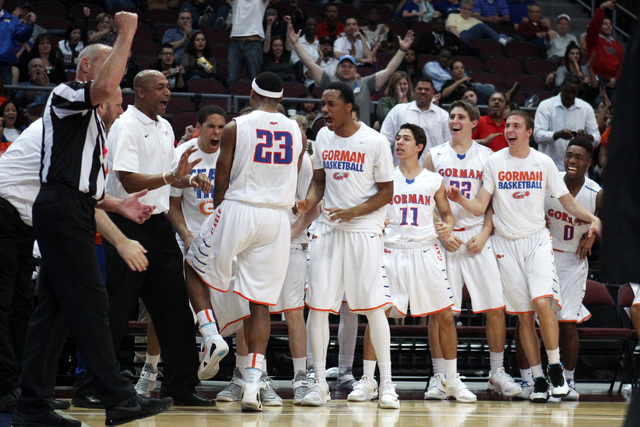 The Bishop Gorman bench celebrates after guard Nick Blair scored and drew a foul on Palo Ver ...