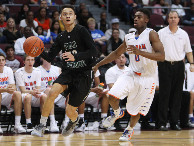 Palo Verde guard Taylor Miller drives past Bishop Gorman guard Ugo Amadi during their Divisi ...