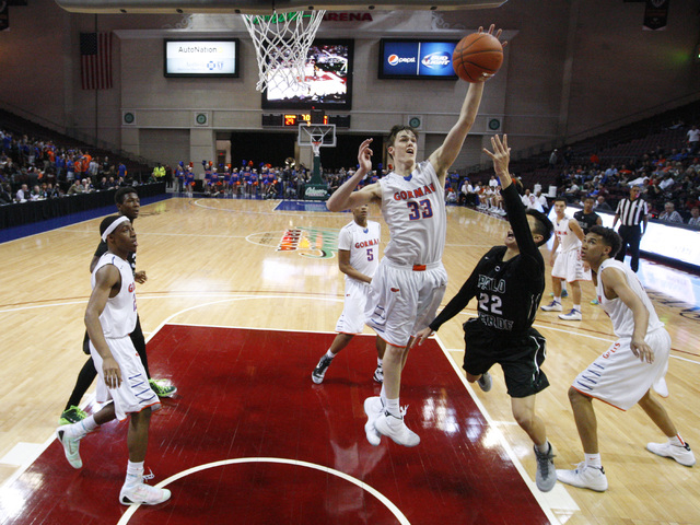 Bishop Gorman centers Stephen Zimmerman and Chase Jeter defend a shot by Palo Verde guard Ta ...