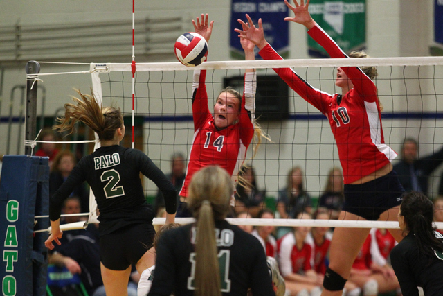 Coronado’s Cali Thompson (14) and Berkeley Oblad (1) attempt to block an attack from P ...