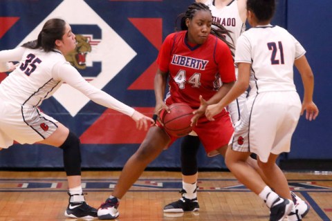 Liberty junior Dre’una Edwards (44) looks for a shot during a basketball game on Tuesd ...