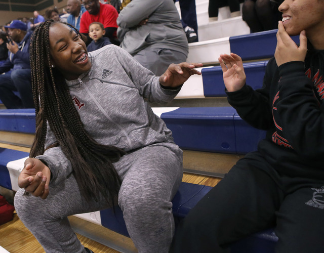 Liberty junior Dre’una Edwards laughs with a teammate during a basketball game on Tues ...
