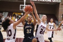 Faith Lutheran guard Kim Munro, left and forward Morgan Hill defend Spring Valley forward Ly ...