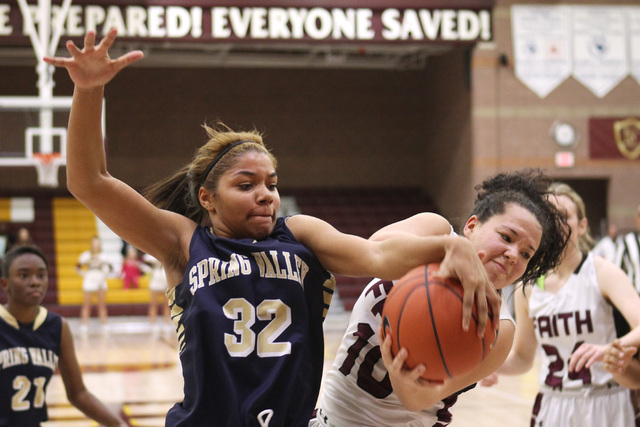 Spring Valley forward Lynnae Wilds and Faith Lutheran guard Kim Munro fight for a rebound on ...