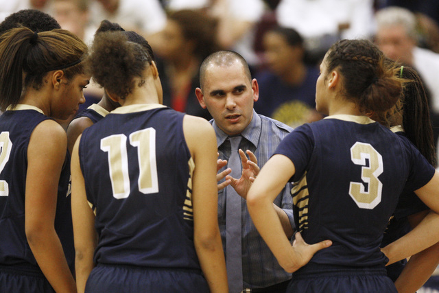Spring Valley coach Billy Hemberger talks to his team during a timeout in their game against ...