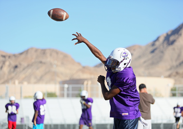 Sunrise Mountain senior quarterback Damon Heard throws the ball during a practice. Heard thr ...