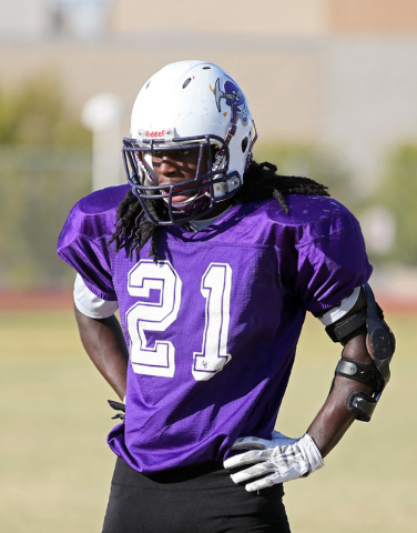 Sunrise Mountain senior running back Wanya Calahan listens to instruction during a practice. ...