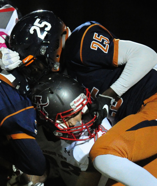 Legacy linebacker Quavion Arnold (25) grabs the facemask of Arbor View running back Deago St ...