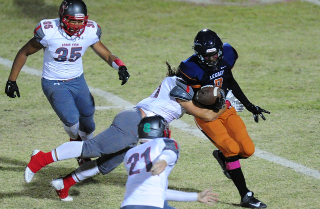 Arbor View linebacker Zach Melson forces Legacy punt returner Marquell to fumble in the seco ...