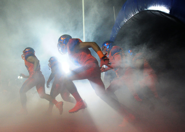 Bishop Gorman players take the field before the start of their prep football game against St ...
