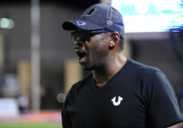 Former Dallas Cowboys wide receiver and St. Thomas Aguinas, Fla. alum, Michael Irvin, cheers ...