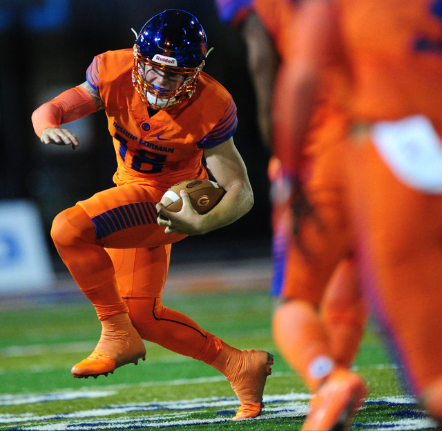 Bishop Gorman quarterback Tate Martell scrambles against St. Thomas Aguinas, Fla. in the f ...