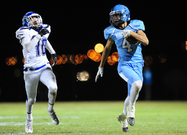 Canyon Springs High School wide receiver Joseph Haulcyafter (4) scores on a 65 yard receptio ...