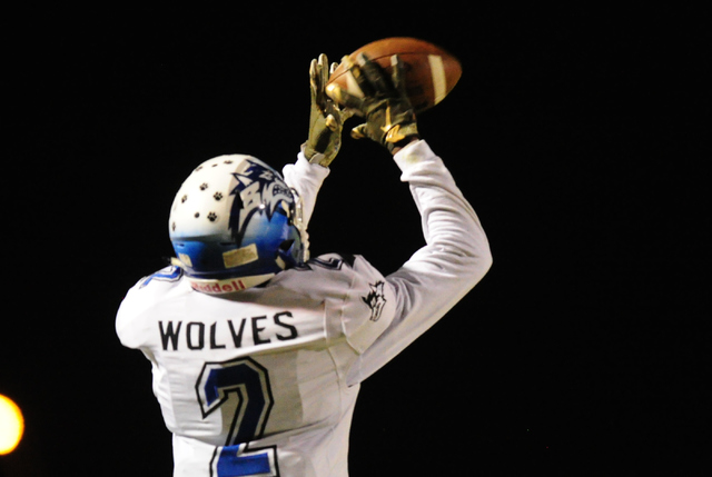 Basic High School wide receiver De’shawn Eagles catches a pass for a first down agains ...