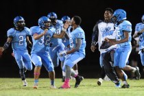 Canyon Springs players celebrate after kicker Cesar Barron-Rodriguez (32) kicked the game wi ...