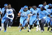 Canyon Springs players celebrate after kicker Cesar Barron-Rodriguez (32) kicked the game wi ...