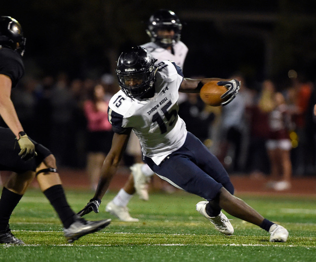 Shadow Ridge running back Malik Lindsey (15) carries the ball against Faith Lutheran during ...