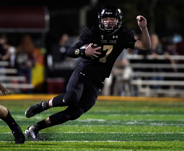 Faith Lutheran quarterback Sagan Gronauer carries the ball against Shadow Ridge during a hig ...