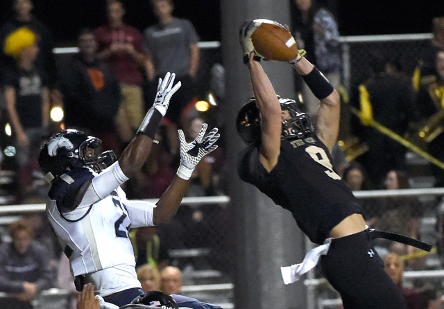 Faith Lutheran’s Keagan Touchstone (9) intercepts the ball against Shadow Ridge’ ...