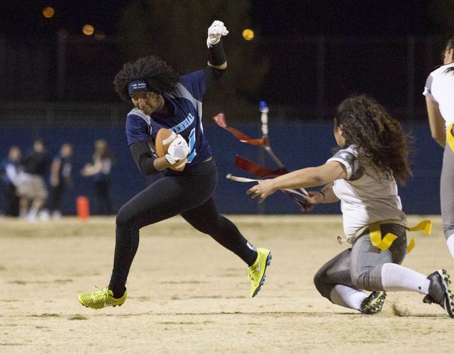 Centennial senior Chantay Dixon attempts to run the ball during a game against Cimarron-Memo ...