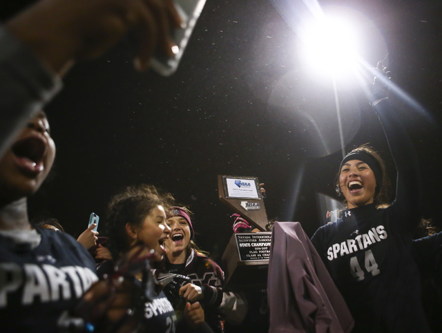 Cimarron-Memorial players celebrate after defeating Coronado 24-7 in the Class 4A state cham ...