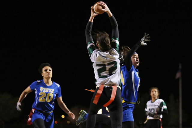 Palo Verde junior Betsy Bellinger catches a pass as Sierra Vista players attempt to intercep ...