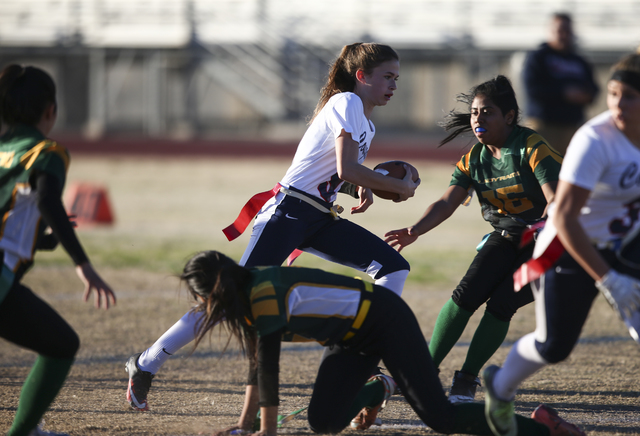 Coronado’s Caitlin Shannon (9) runs the ball against Rancho during a flag f...