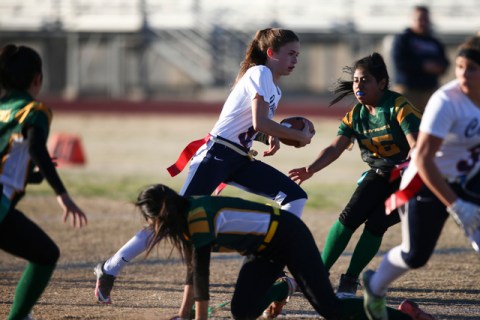 Coronado’s Caitlin Shannon (9) runs the ball against Rancho during a flag football gam ...